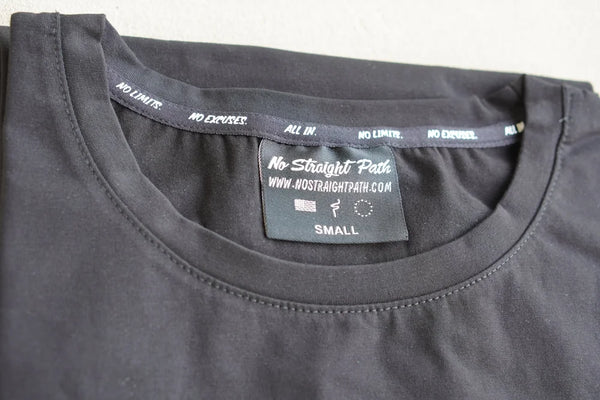 black t-shirt with a brand label on the collar