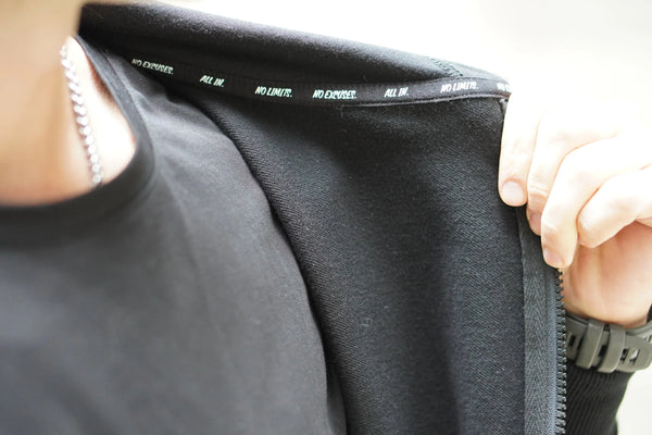 Person wearing a black jacket with visible No Straight Path® branding on the collar.