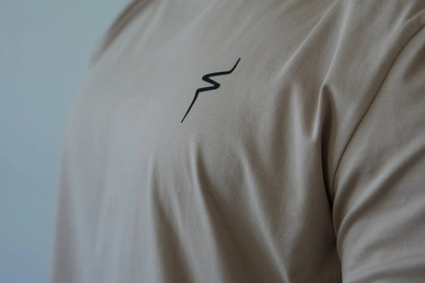 Beige shirt with a black No Straight Path® logo.