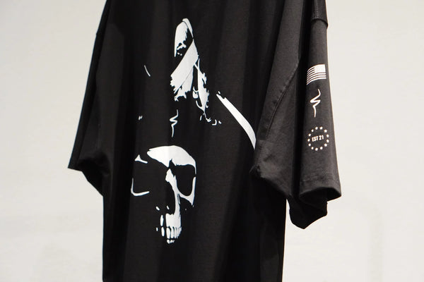 Black t-shirt with white graphic design on a plain background