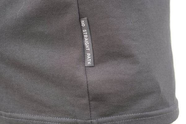 Gray fabric with a label reading 'No Straight Path' on a white background