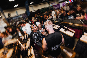 People gathered inside the No Straight Path booth at the 2026 Austin Marathon Expo in Austin, Texas.