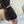 Woman wearing black athletic shorts with a blurred background
