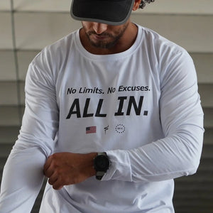 Man wearing a white long-sleeve shirt with motivational text and No Straight Path® logos.