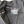 Close-up of a gray hoodie with a No Straight Path® brand label on a white background