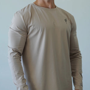Beige long-sleeve shirt with a No Straight Path® logo on a plain background