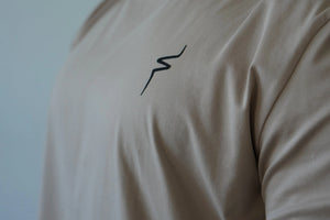 Beige shirt with a black No Straight Path® logo.