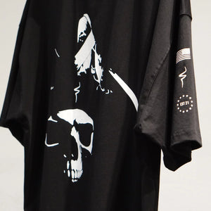 Black t-shirt with white graphic design on a plain background