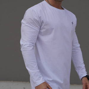 Person wearing a white long-sleeve shirt with a No Straight Path® logo on a gray background