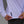 Person wearing a white long-sleeve shirt with a No Straight Path® woven tag.