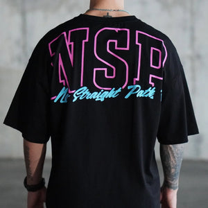Person wearing a black t-shirt with a pink and blue No Straight Path® design on the back, standing against a plain background.