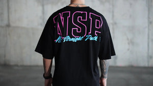 Person wearing a black t-shirt with a pink and blue No Straight Path® design on the back, standing against a plain background.