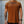 Person wearing a brown t-shirt with No Straight Path® text against a concrete wall.