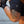 Person wearing black shorts with a No Straight Path® logo on a neutral background