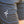 Close-up of black shorts with a white No Straight Path® logo on a blurred background