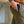 Person wearing green shorts with a blurred background