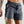 Person wearing gray-blue athletic shorts on a plain background