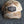 Camouflage-patterned cap on a textured surface