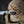 Camouflage baseball cap with a No Straight Path® patch on a dark background