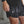 Person wearing black athletic shorts with white pattern and No Straight Path® logo.
