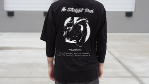 Person wearing a black t-shirt with white graphics and text on the back.
