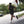 Person running on a sidewalk with a stop sign in the background