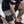 Person tying their shoes on a light gray floor