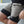 Person wearing shorts with visible No Straight Path® branding, sitting on a concrete surface.