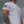 Person wearing a white t-shirt with a USA flag design on a cloudy day
