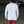 Person wearing a white long-sleeve shirt and red shorts in an outdoor setting.